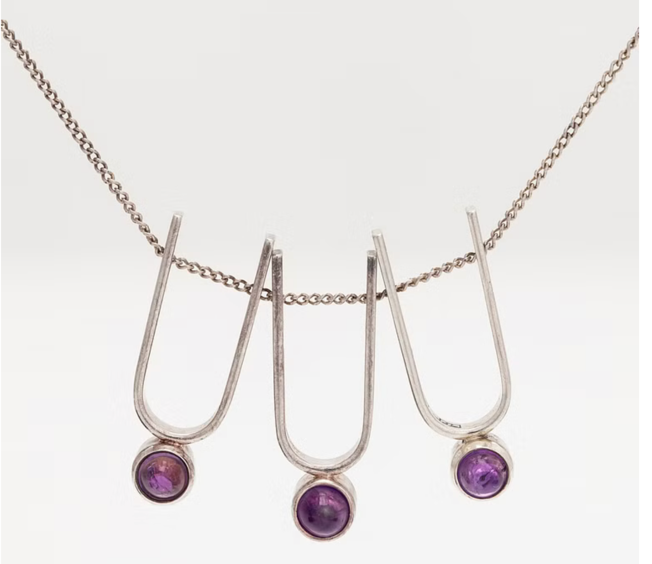 Elis Kauppi, a silver and amethyst pendant necklace