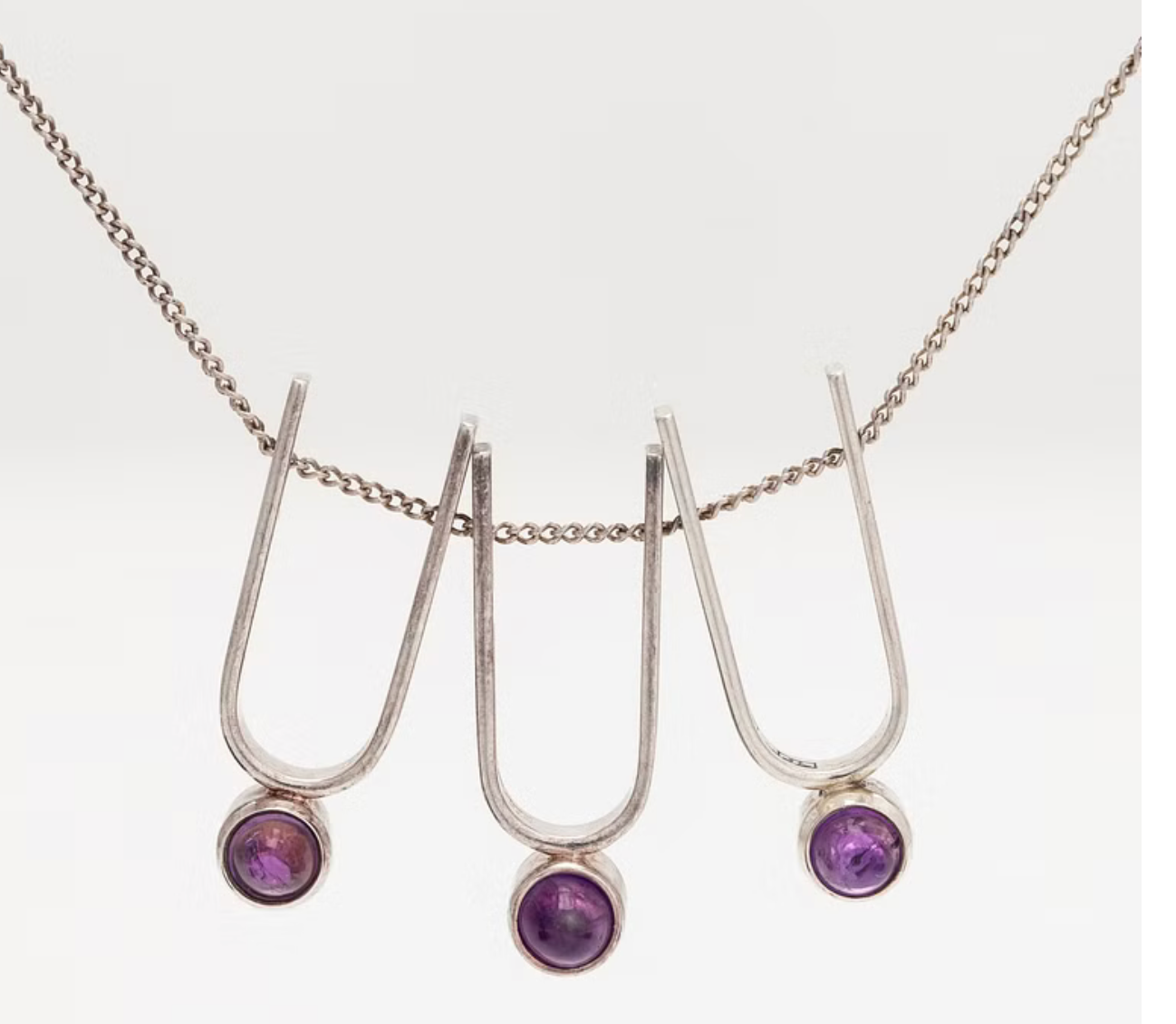 Elis Kauppi, a silver and amethyst pendant necklace