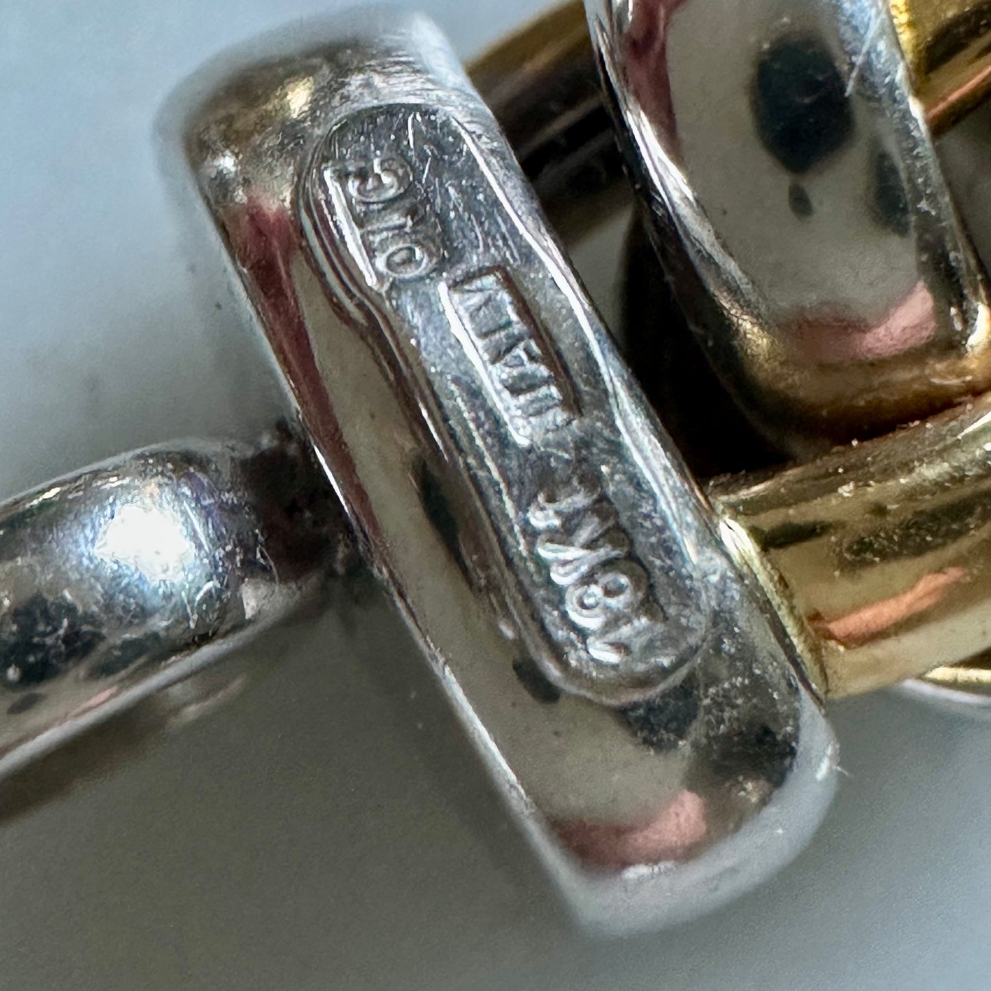 18k white and yellow gold oval link bracelet with toggle clasp and diamonds