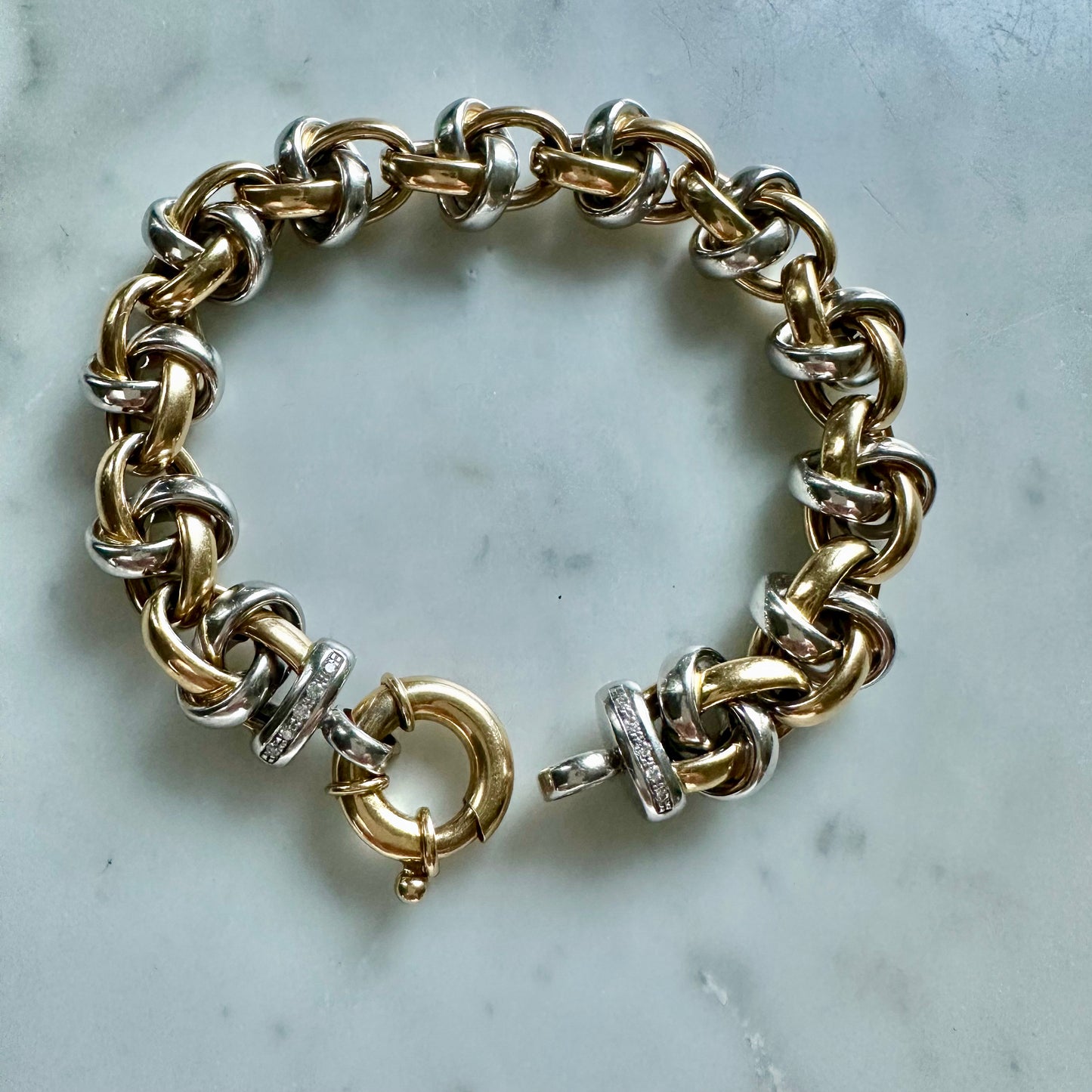 18k white and yellow gold oval link bracelet with toggle clasp and diamonds