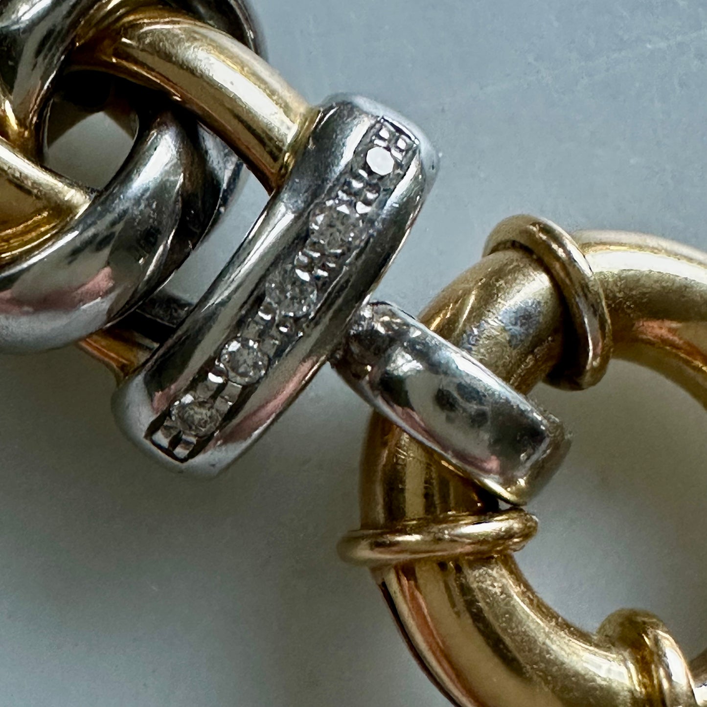 18k white and yellow gold oval link bracelet with toggle clasp and diamonds