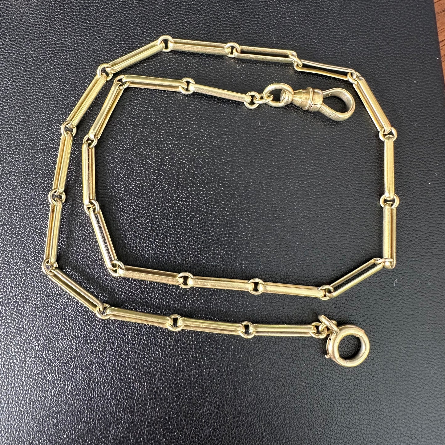 Trombone link watch chain marked and tests 15k 14.5 inches long
