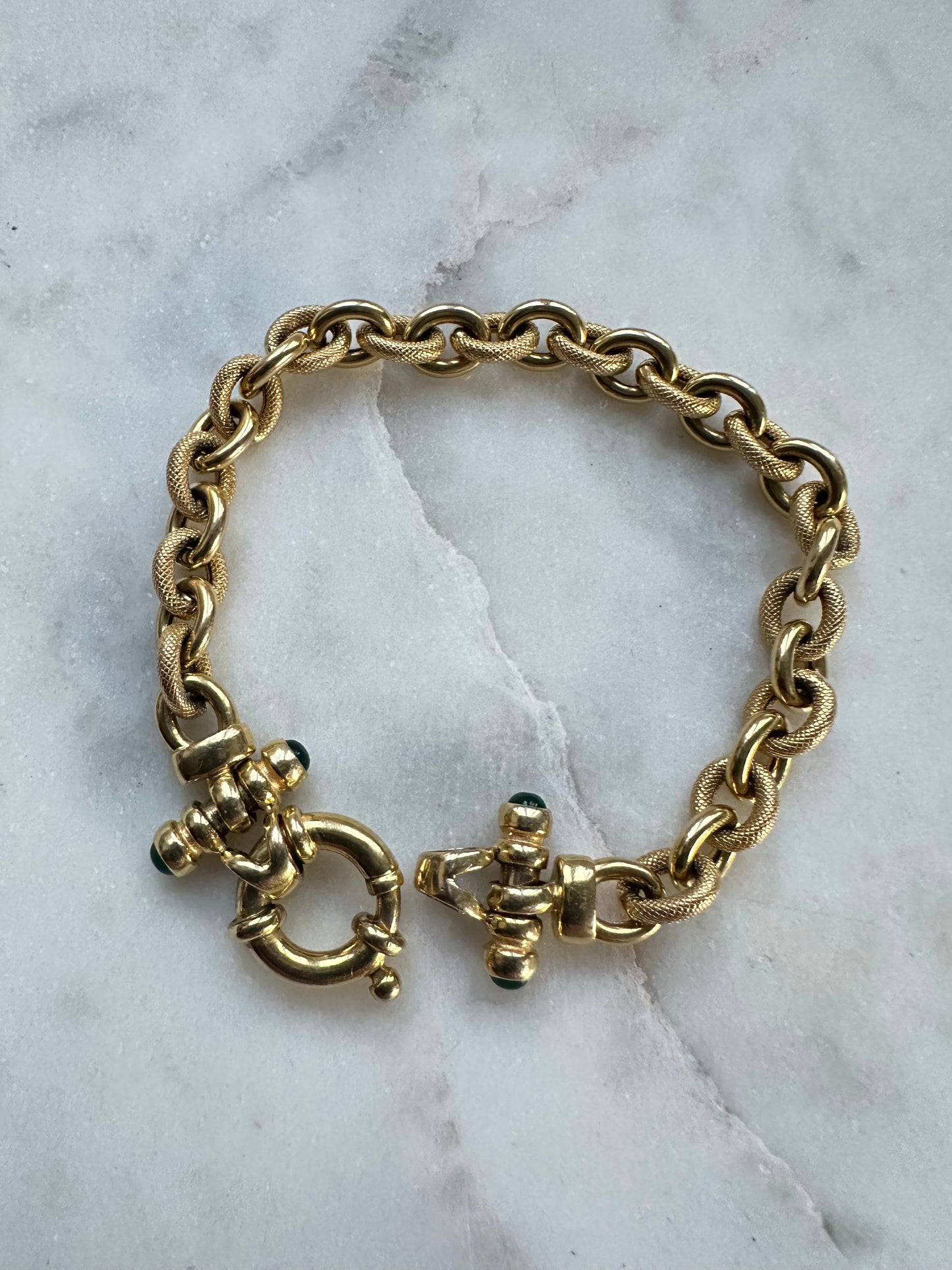 Italian 14k Gold fancy Link 1/2 textured with emerald accents end caps 7.25“