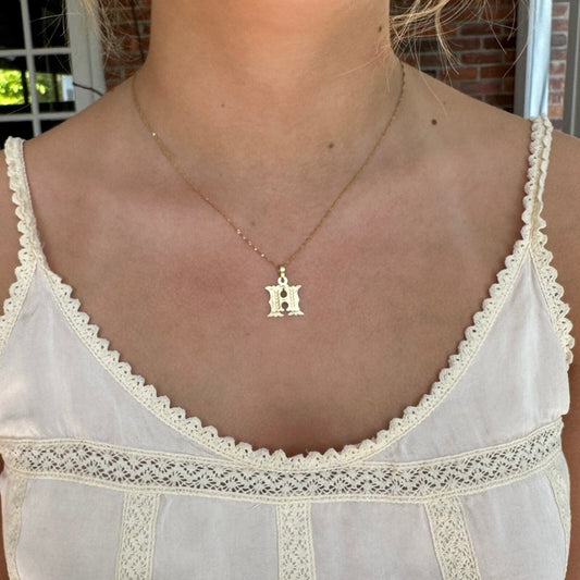 14k gold H raised double image pendant