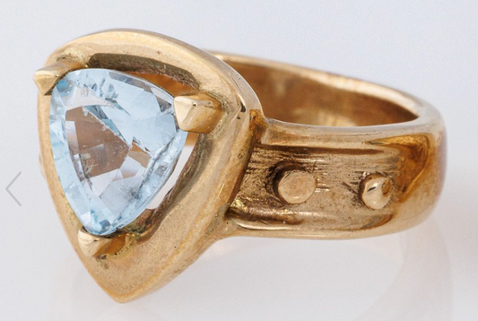 13k yellow gold ring with blue topaz, size 6,   4.7 dwt.  ( 7.31 g)