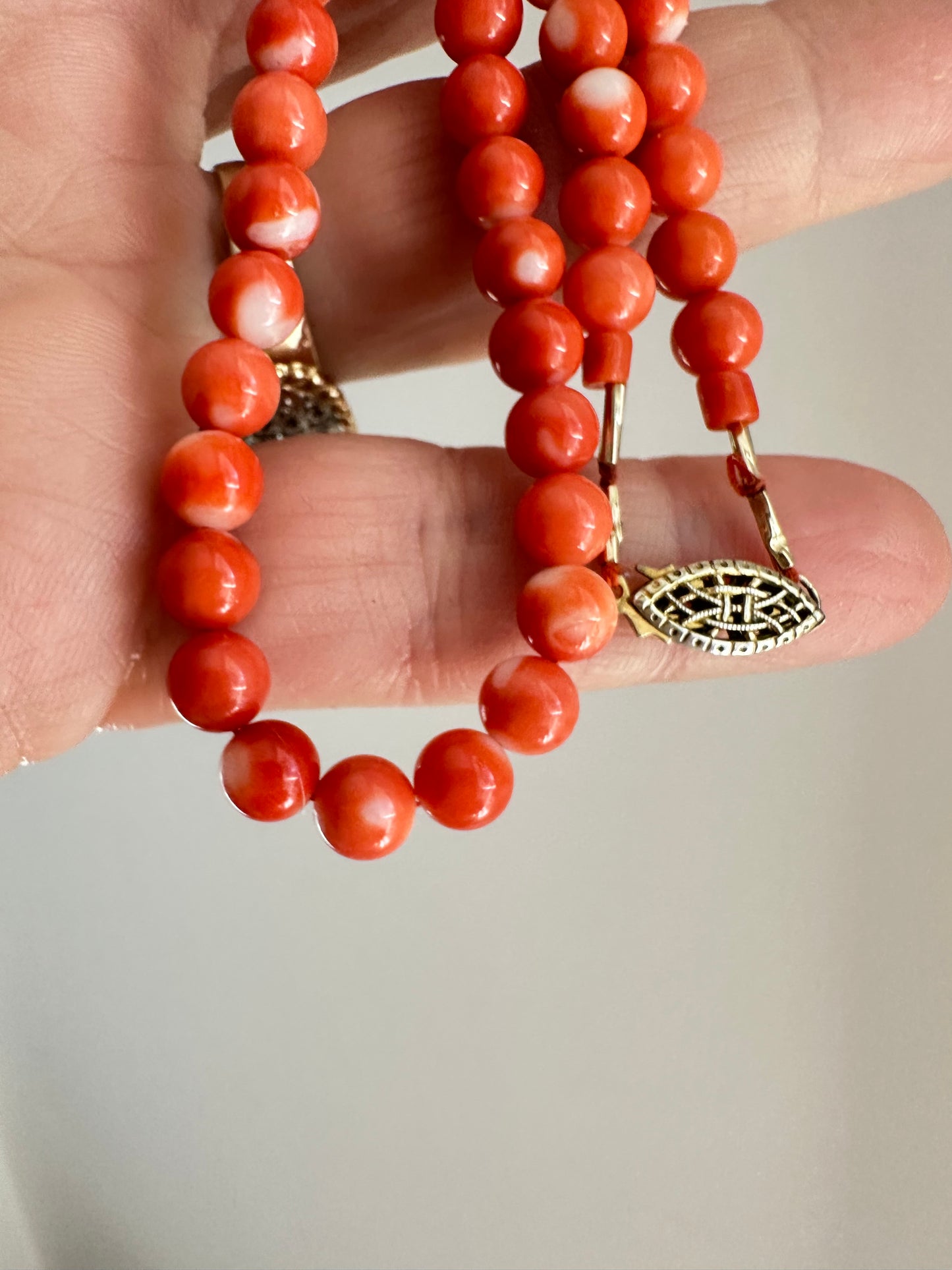Victorian reddish orange coral beads with 9k clasp