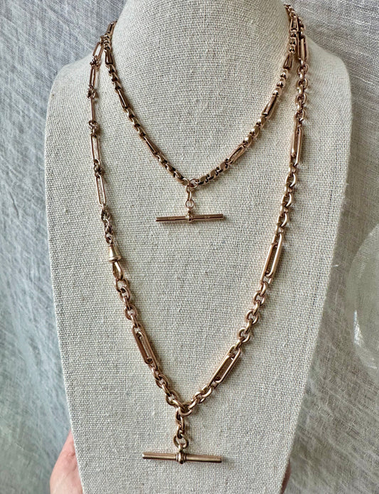 Antique 9k gold 20” trombone and lovers knot watch chain