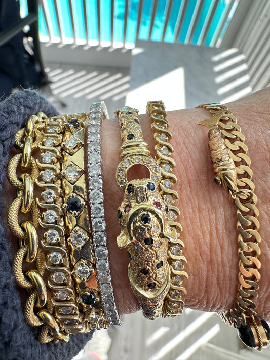 VINTAGE YELLOW GOLD AND GEMSTONE PANTHER BANGLE BRACELET