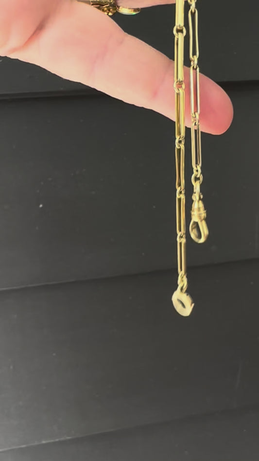 Trombone link watch chain marked  and tests 15k 14.5 inches long